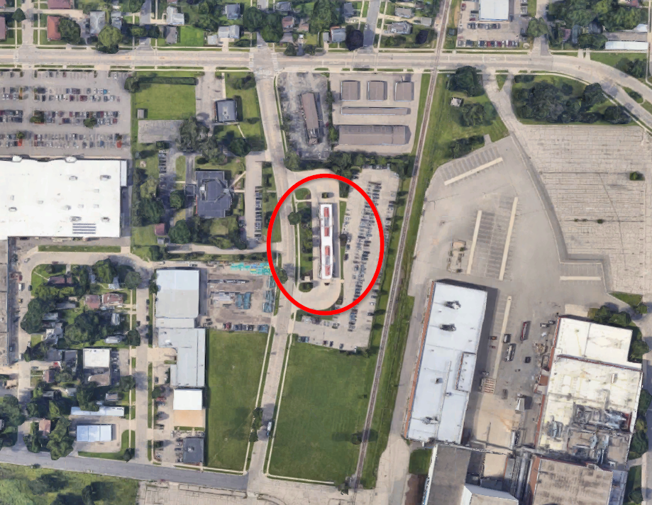 Aerial imagery of North Transfer Point. The area around the transfer point has parking lots, low-density residential housing, and the now-closed Oscar Meyer plant. Image: Google Maps.